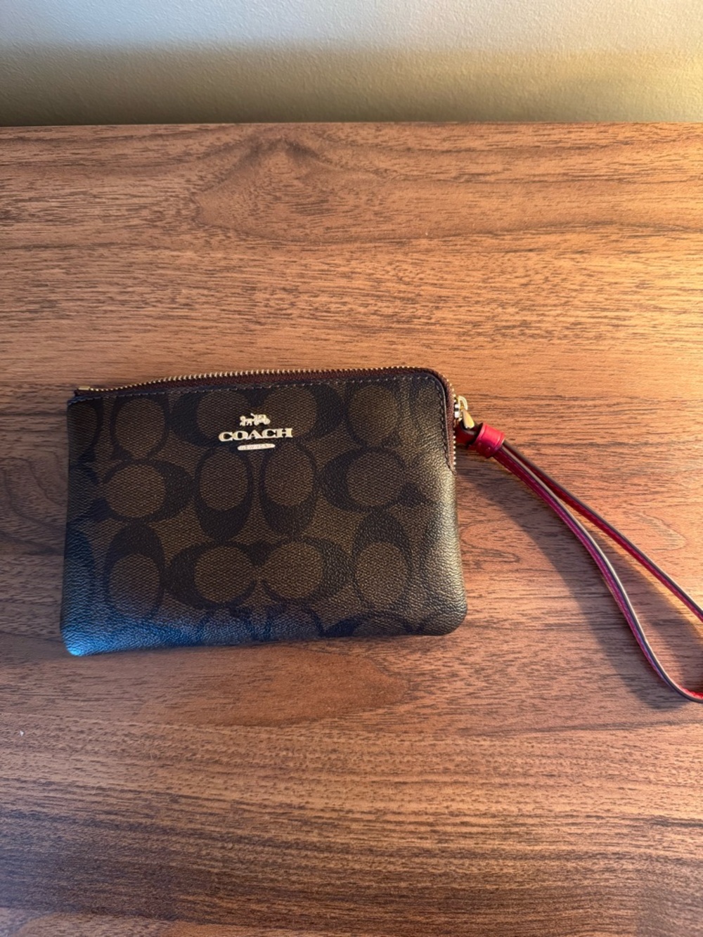 Coach Brown Signature Wristlet with Red Strap